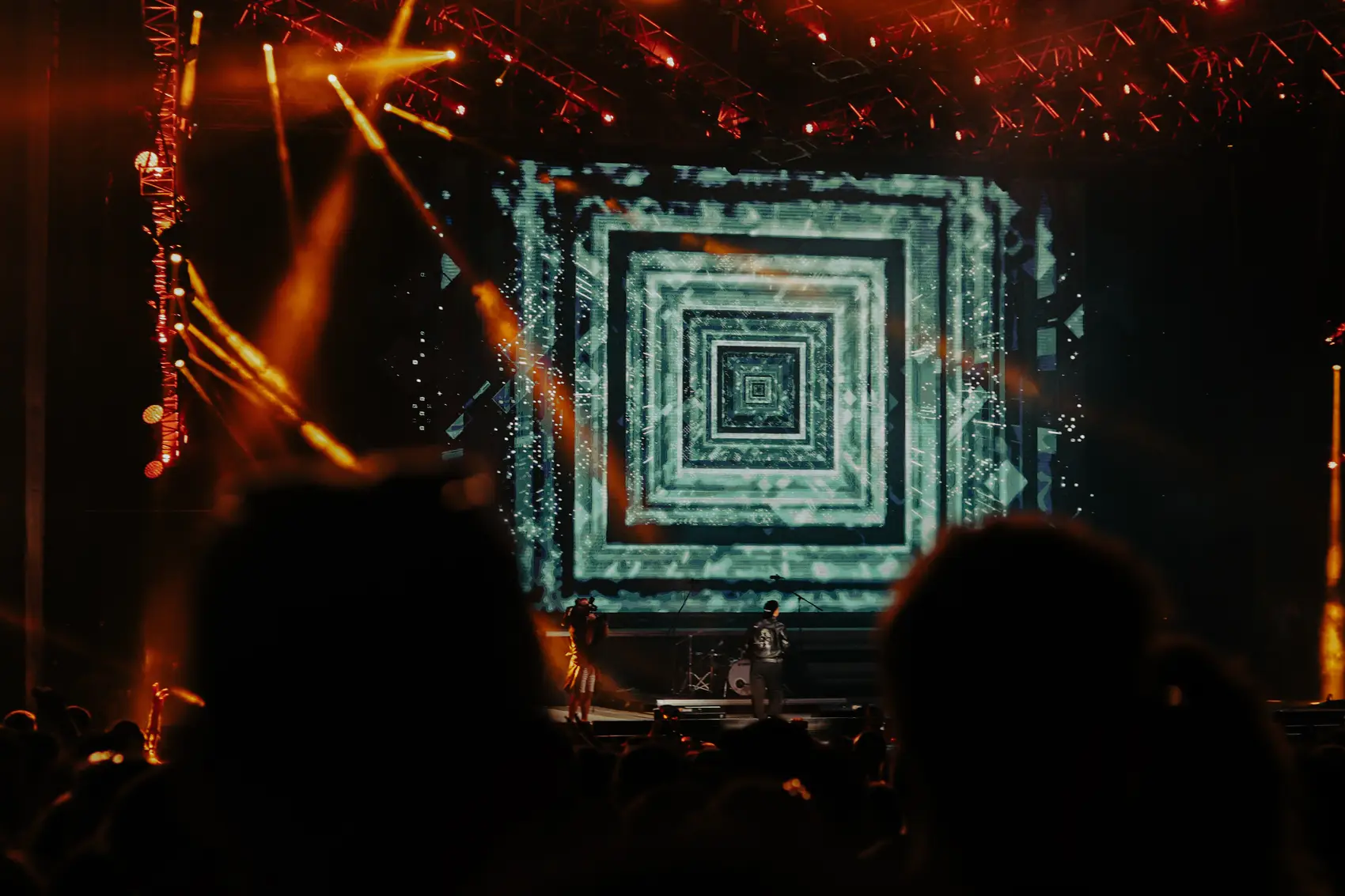 Kaleidoscopic tunnel of stage lighting over the crowd