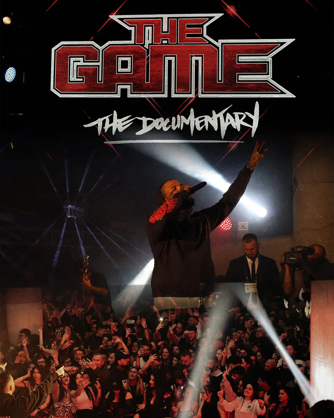 Rap artist commanding the stage in front of a roaring crowd